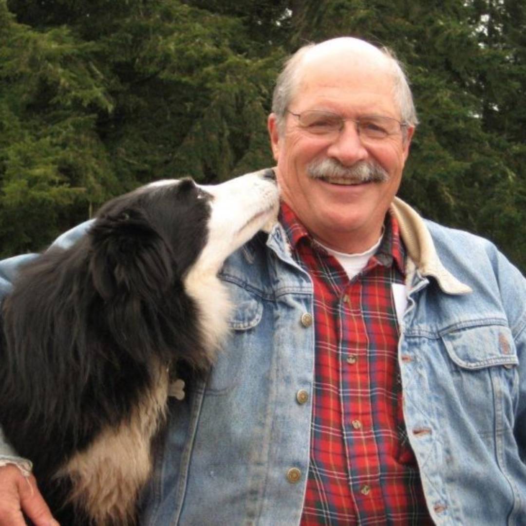 A family sitting with their dog