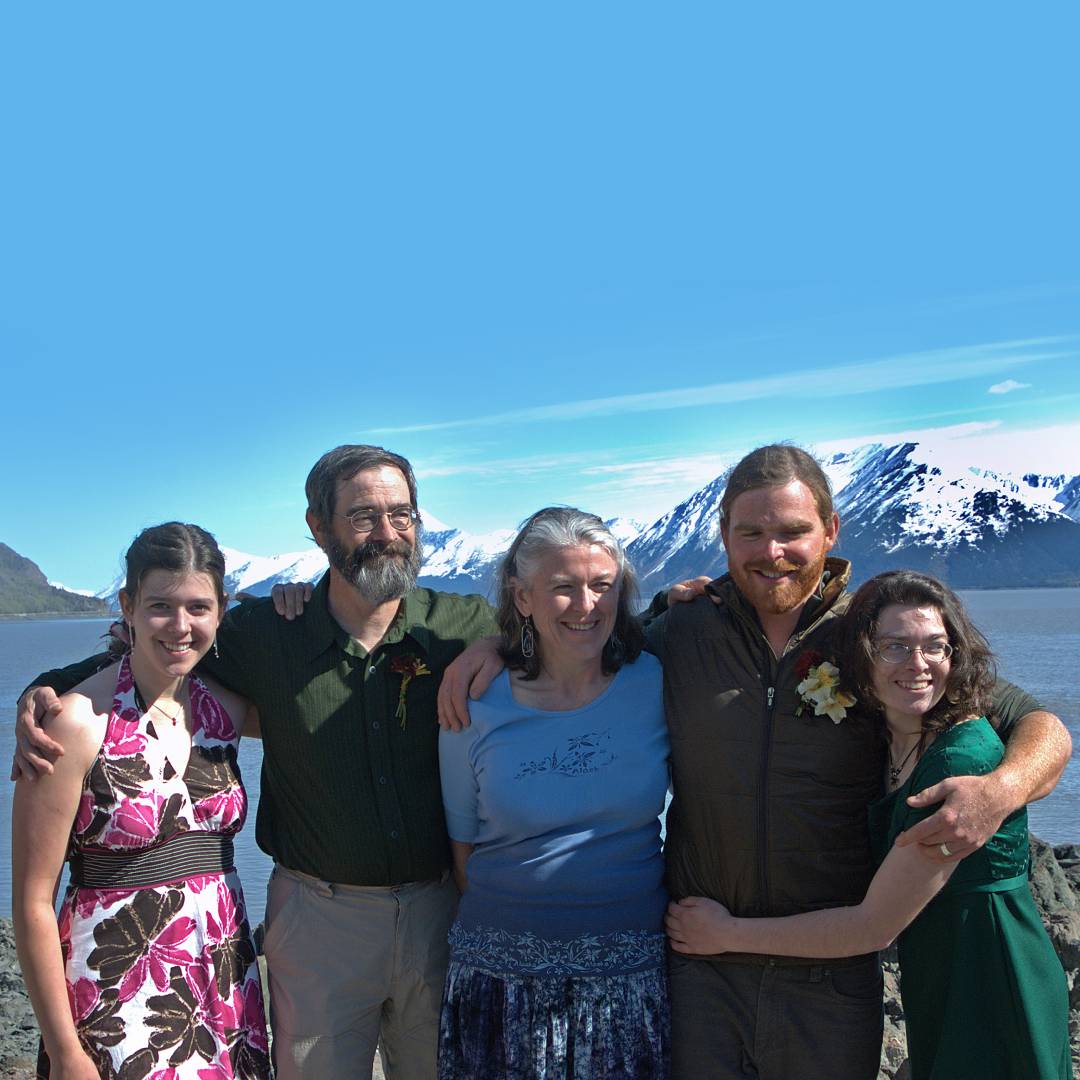 A family sitting with their dog